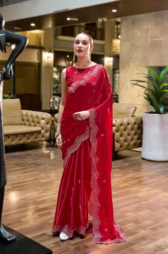 Red embroidered embellished shimmer chiffon bollywood saree with blouse