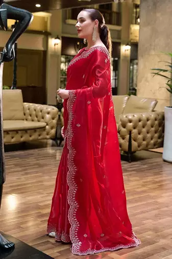 Red embroidered embellished shimmer chiffon bollywood saree with blouse