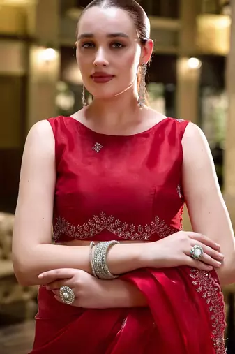 Red embroidered embellished shimmer chiffon bollywood saree with blouse