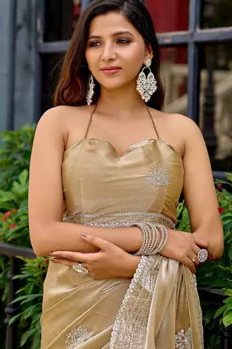 Beige embroidered embellished shimmer chiffon bollywood saree with blouse