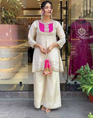 Elegant off-white embroidered kurti set with pink yoke design 1