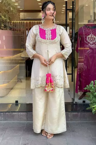 Elegant off-white embroidered kurti set with pink yoke design