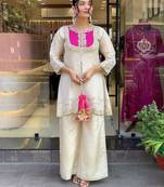 Elegant off-white embroidered kurti set with pink yoke design