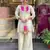 Elegant off-white embroidered kurti set with pink yoke design