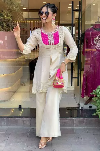 Elegant off-white embroidered kurti set with pink yoke design