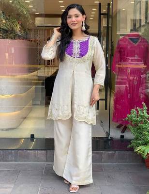Elegant off-white embroidered kurti set with purple yoke design 1