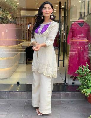 Elegant off-white embroidered kurti set with purple yoke design 2