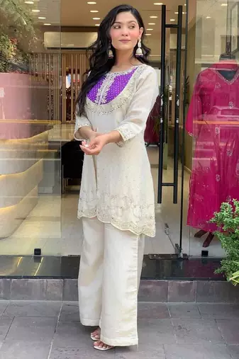 Elegant off-white embroidered kurti set with purple yoke design