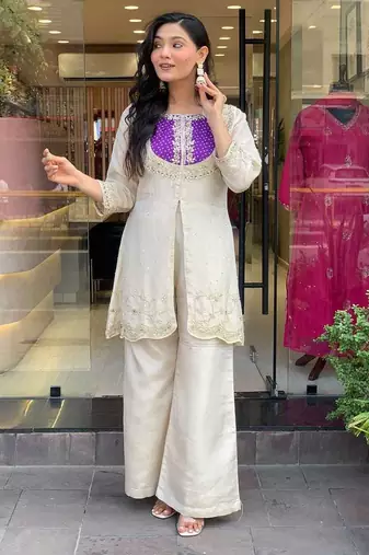 Elegant off-white embroidered kurti set with purple yoke design
