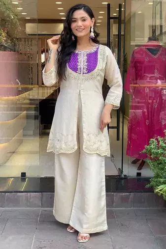 Elegant off-white embroidered kurti set with purple yoke design