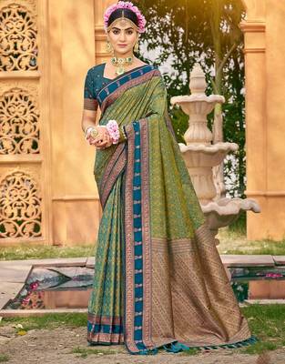 Rich and ethnic looking green woven soft silk blend saree 1