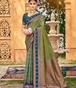 Rich and ethnic looking green color woven soft silk saree