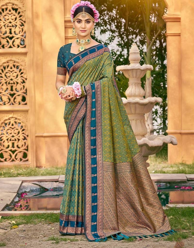 Rich and ethnic looking green color woven soft silk saree