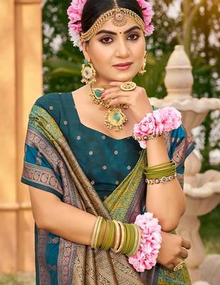 Rich and ethnic looking green woven soft silk blend saree 2