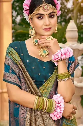 Rich and ethnic looking green woven soft silk blend saree