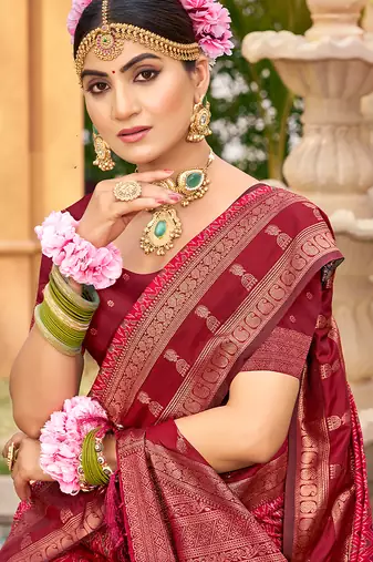 Rich and ethnic looking pink woven soft silk blend saree