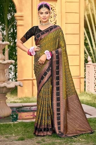 Rich and ethnic looking mahendi color woven soft silk saree