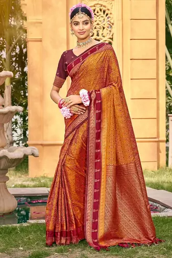 Rich and ethnic looking rust color woven soft silk saree