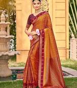 Rich and ethnic looking rust color woven soft silk saree
