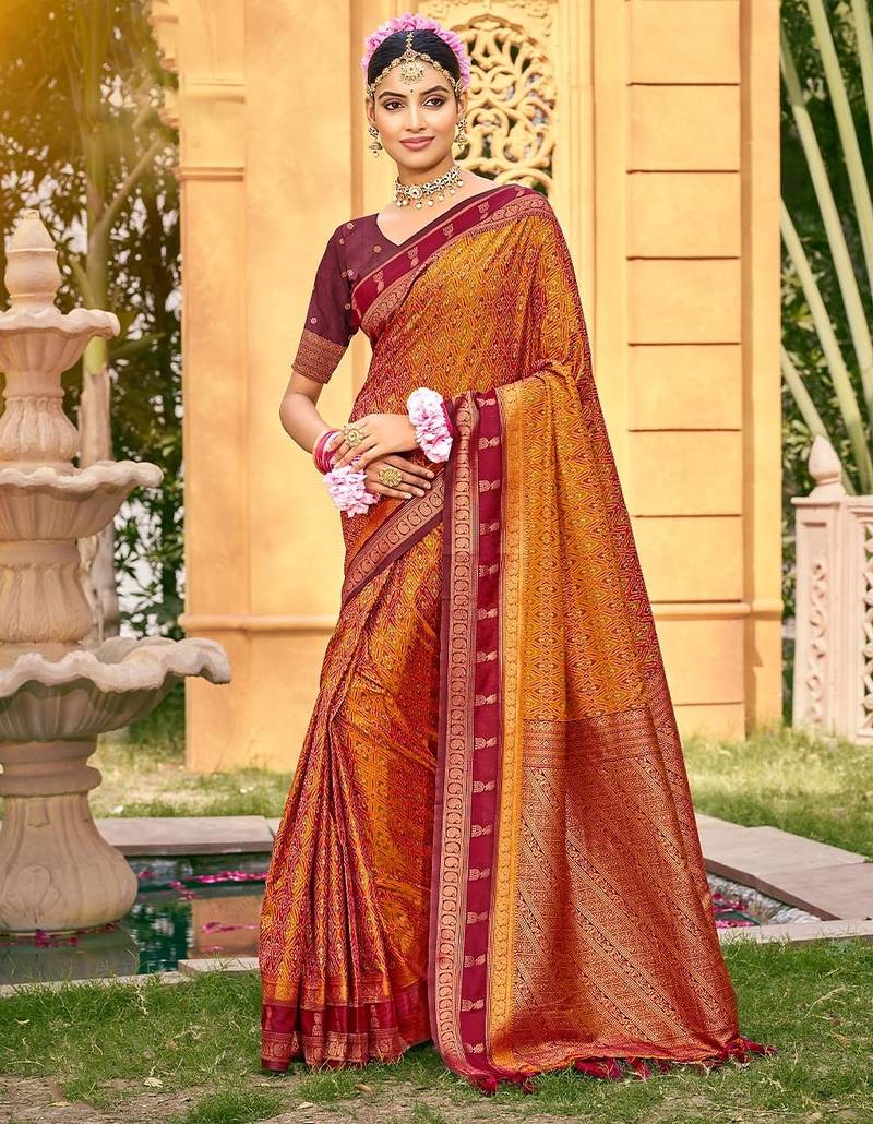 Rich and ethnic looking rust color woven soft silk saree