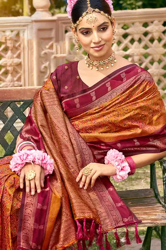 Rich and ethnic looking rust woven soft silk blend saree