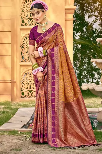 Rich and ethnic looking yellow color woven soft silk saree