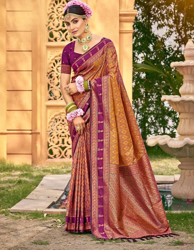 Rich and ethnic looking yellow color woven soft silk saree