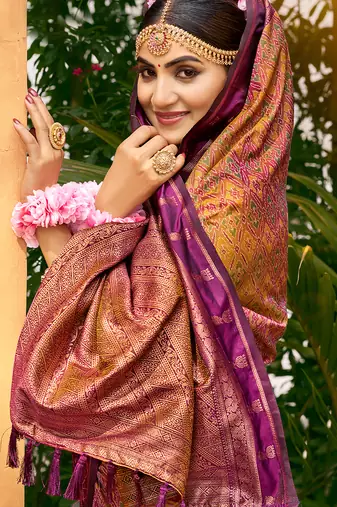 Rich and ethnic looking yellow woven soft silk blend saree