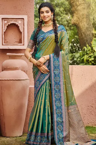 Green color smart and ethnic woven designer soft silk saree