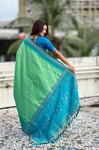 Pista woven meenakari ikkat patola silk blend saree