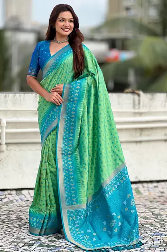 Pista woven meenakari ikkat patola silk blend saree