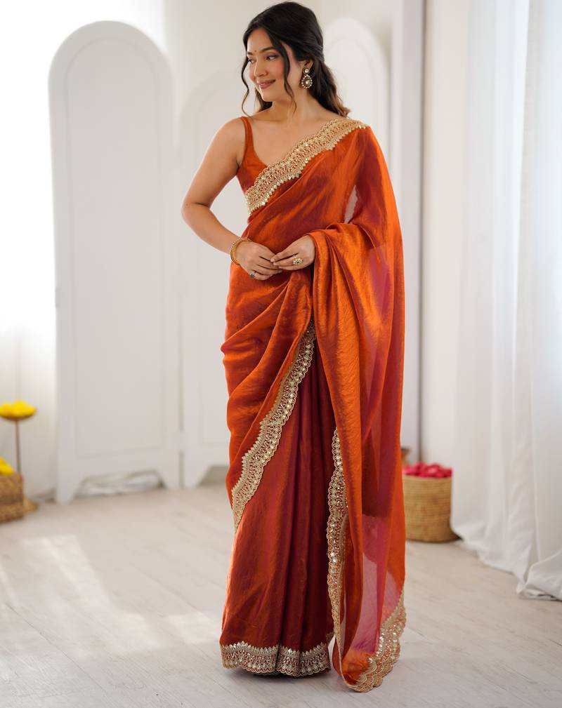 Orange color stylish fendy satin silk fabric bollywood style saree