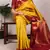 Yellow printed poly cotton saree with red zari border