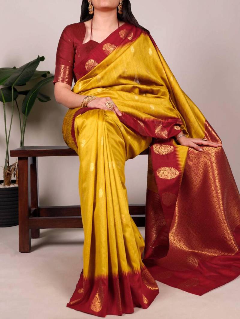 Yellow printed poly cotton saree with red zari border