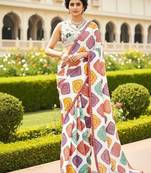 Multicolor printed saree with colorful geometric motifs and floral blouse