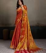 Orange color tissue silk fabric woven designer partywear saree