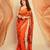 Orange floral printed saree with large floral prints and lace border