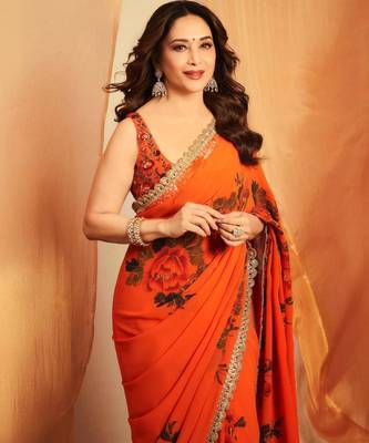 Orange floral printed saree with large floral prints and lace border 3