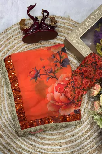 Orange floral printed saree with large floral prints and lace border