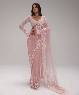 Pink embroidered net saree with feather-trimmed blouse and tassel detail 2