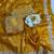 Yellow silk blend saree with scalloped zari border and striped blouse
