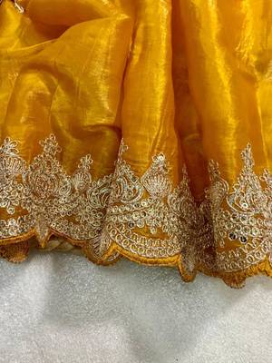 Yellow silk blend saree with scalloped zari border and striped blouse 3