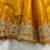 Yellow silk blend saree with scalloped zari border and striped blouse