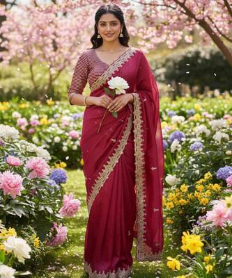 Red silk blend saree with scalloped zari border and striped blouse 1