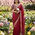 Red silk blend saree with scalloped zari border and striped blouse