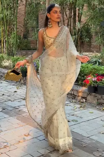Cream embroidered saree with gold sequins-work