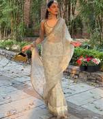 Cream embroidered saree with gold sequins-work