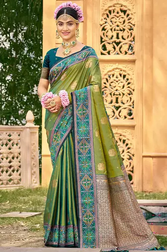 Green color woven designer soft silk fabric for ethnic party looks