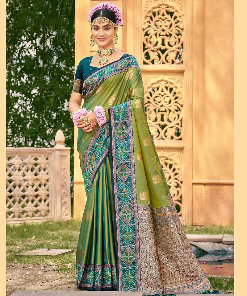 Green color woven designer soft silk fabric for ethnic party looks