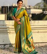 Mahendi color paithani silk fabric woven designer saree